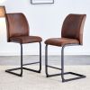 A set of two brown chairs, including suede cushions and black metal legs. Small size, suitable for select groups, suitable for dining room, kitchen